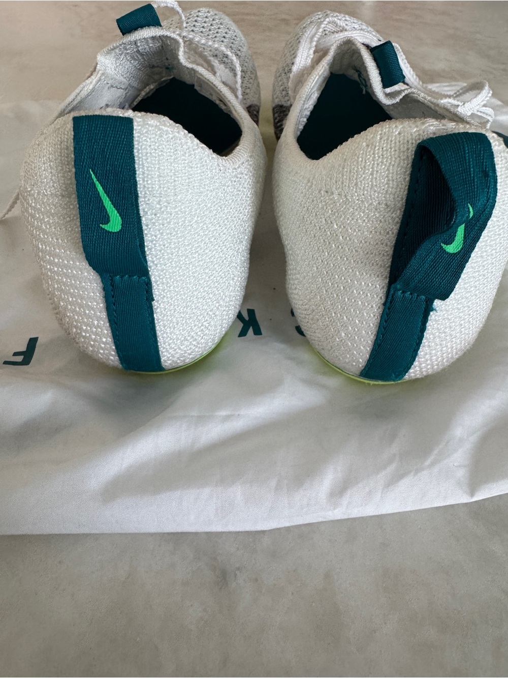 Nike White and Teal Flyknit Running Track Shoes with Black Swoosh spikes - Picture 9 of 13